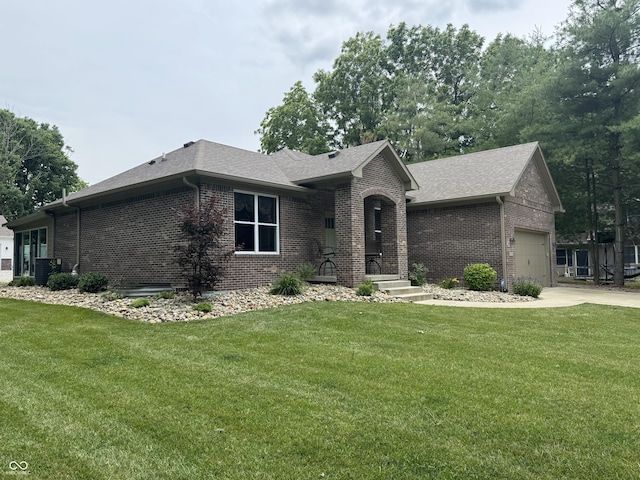188 Gettysburg, Coatesville, IN 46121 - ranch-style home with brick siding, a shingled roof, a front lawn, and concrete driveway