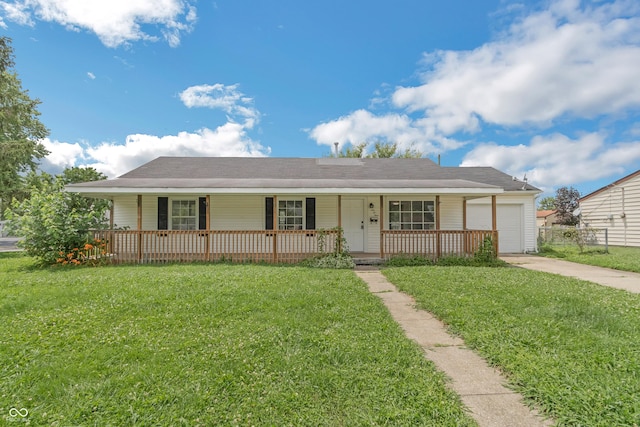 609 Willow Dr, Shelbyville, IN 46176 - ranch-style house with a porch, an attached garage, and driveway