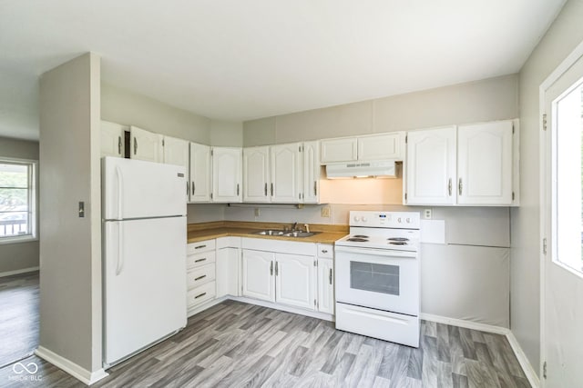 609 Willow Dr, Shelbyville, IN 46176 - kitchen featuring white appliances, under cabinet range hood, white cabinetry, and plenty of natural light