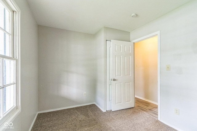 609 Willow Dr, Shelbyville, IN 46176 - unfurnished bedroom with carpet flooring and baseboards