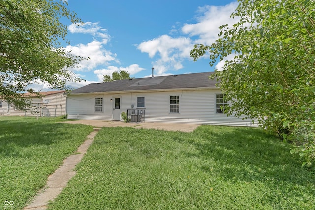 609 Willow Dr, Shelbyville, IN 46176 - back of house featuring a patio area and a lawn