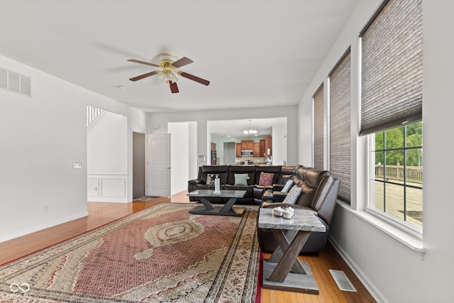 7350 Gold King Way, Indianapolis, IN 46259 - living area with light wood-style flooring and a ceiling fan