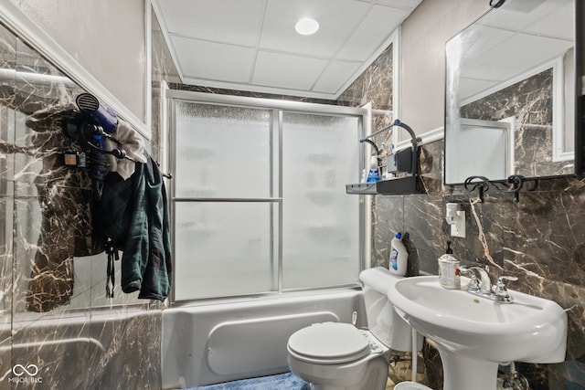7350 Gold King Way, Indianapolis, IN 46259 - full bathroom featuring combined bath / shower with glass door, tile walls, and a drop ceiling