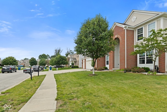 7350 Gold King Way, Indianapolis, IN 46259 - view of grassy yard featuring driveway and a residential view
