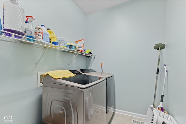 7350 Gold King Way, Indianapolis, IN 46259 - laundry area with washer and dryer and light tile patterned floors