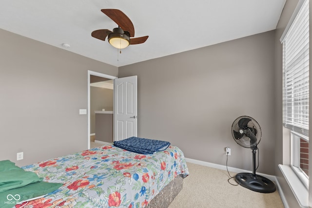 7350 Gold King Way, Indianapolis, IN 46259 - bedroom with carpet, multiple windows, and a ceiling fan