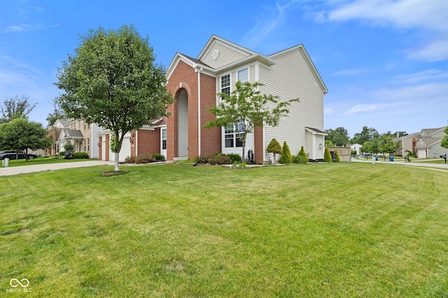 7350 Gold King Way, Indianapolis, IN 46259 - view of front of home featuring brick siding, driveway, and a front lawn