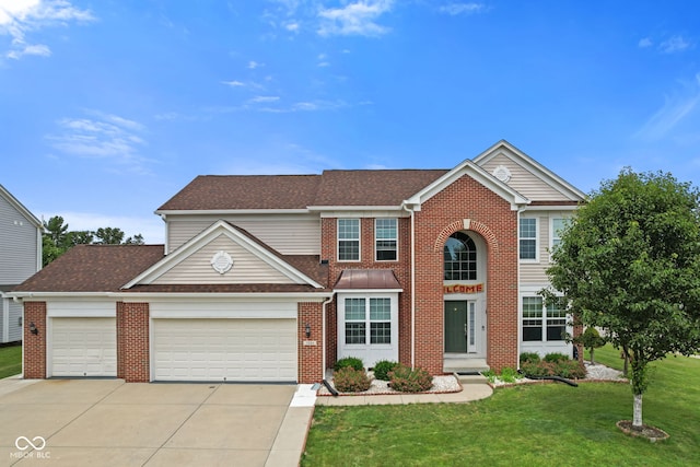 7350 Gold King Way, Indianapolis, IN 46259 - view of front of property featuring an attached garage, brick siding, driveway, a front lawn, and a shingled roof