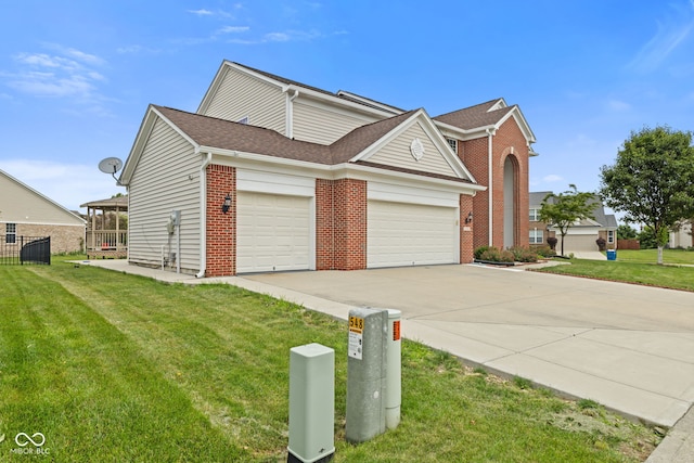 7350 Gold King Way, Indianapolis, IN 46259 - view of property exterior with brick siding, a garage, driveway, and a shingled roof