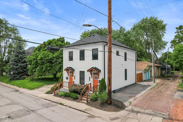 934 Calvary St, Indianapolis, IN 46203 - view of front of house with roof with shingles and a garage