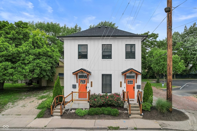 934 Calvary St, Indianapolis, IN 46203 - view of front of house with board and batten siding and a shingled roof