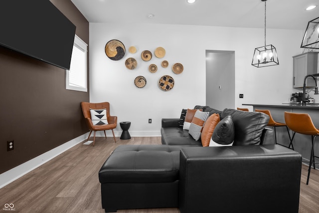 934 Calvary St, Indianapolis, IN 46203 - living area featuring wood finished floors, a chandelier, and recessed lighting
