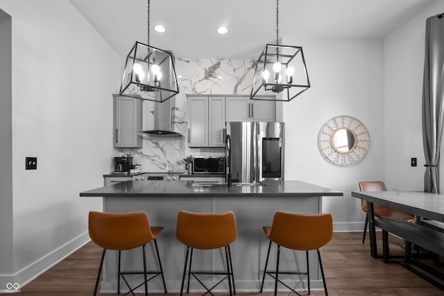 934 Calvary St, Indianapolis, IN 46203 - kitchen with smart refrigerator, a chandelier, dark countertops, gray cabinetry, and a breakfast bar area