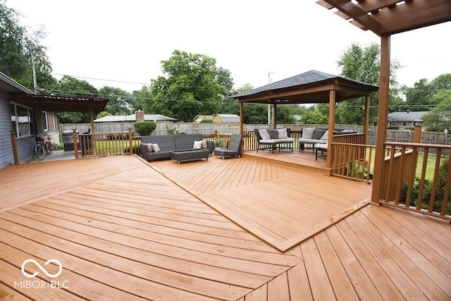 4430 Wexford Rd, Indianapolis, IN 46226 - wooden terrace with an outdoor living space, a gazebo, and a fenced backyard