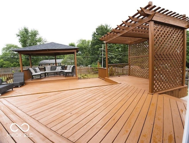 4430 Wexford Rd, Indianapolis, IN 46226 - wooden deck featuring a gazebo, an outdoor living space, and a pergola