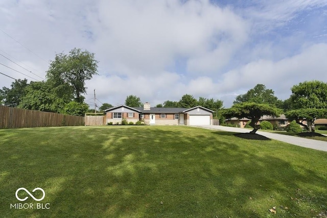 4430 Wexford Rd, Indianapolis, IN 46226 - ranch-style home featuring concrete driveway and a chimney