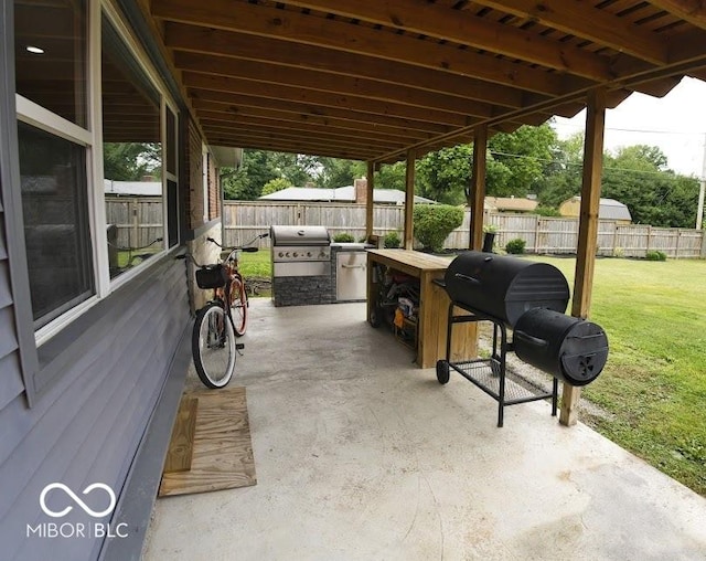 4430 Wexford Rd, Indianapolis, IN 46226 - fenced backyard with grilling area and a patio