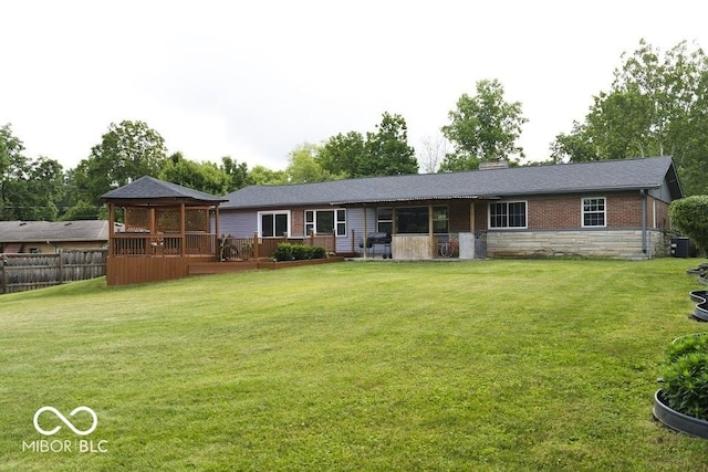 4430 Wexford Rd, Indianapolis, IN 46226 - back of house with a gazebo, stone siding, and a deck