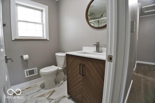 4430 Wexford Rd, Indianapolis, IN 46226 - bathroom with vanity and marble look tile flooring