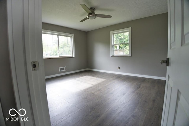 4430 Wexford Rd, Indianapolis, IN 46226 - spare room with dark wood-type flooring, ceiling fan, and a textured ceiling