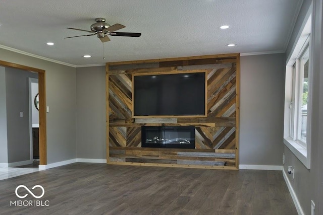 4430 Wexford Rd, Indianapolis, IN 46226 - unfurnished living room featuring ornamental molding, wood finished floors, ceiling fan, a fireplace, and recessed lighting