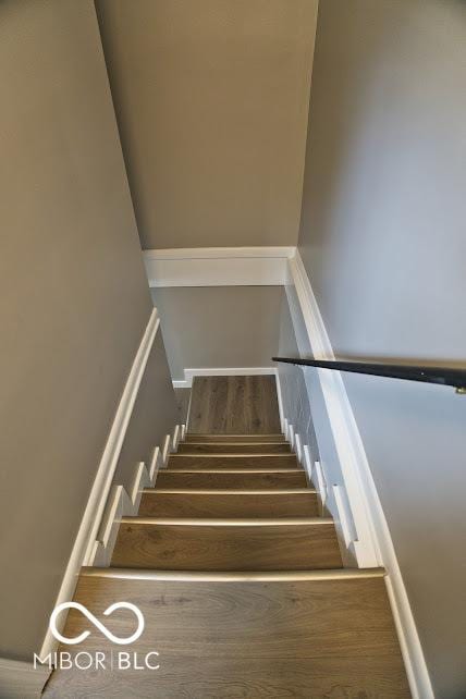 4430 Wexford Rd, Indianapolis, IN 46226 - staircase featuring wood finished floors