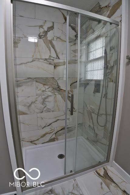 4430 Wexford Rd, Indianapolis, IN 46226 - full bathroom with marble finish flooring and a shower stall
