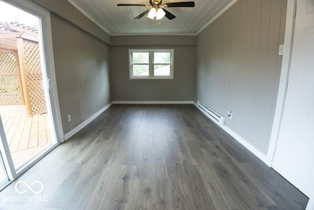 4430 Wexford Rd, Indianapolis, IN 46226 - empty room featuring ornamental molding, baseboard heating, ceiling fan, and dark wood-type flooring