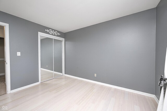 303 E County Road 500 N, Pittsboro, IN 46167 - unfurnished bedroom with light wood finished floors and a closet