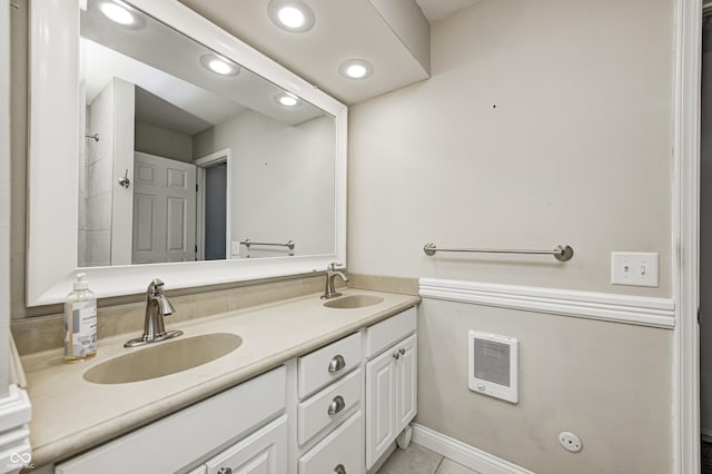 303 E County Road 500 N, Pittsboro, IN 46167 - bathroom featuring heating unit, double vanity, recessed lighting, and tile patterned flooring