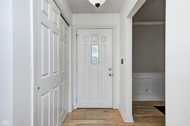 303 E County Road 500 N, Pittsboro, IN 46167 - entryway featuring light wood-style floors and wainscoting