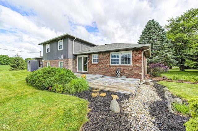 303 E County Road 500 N, Pittsboro, IN 46167 - back of property featuring brick siding, a lawn, a deck, and roof with shingles