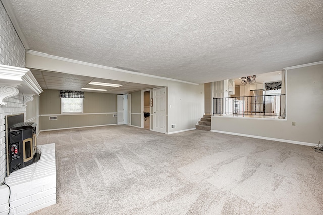 303 E County Road 500 N, Pittsboro, IN 46167 - unfurnished living room with stairs, a wood stove, carpet flooring, ornamental molding, and a textured ceiling