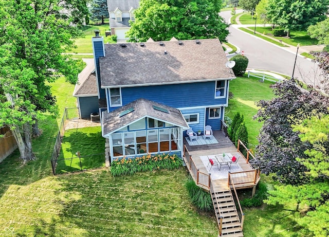1099 Saratoga Cir, Carmel, IN 46280 - rear view of property with a wooden deck, a chimney, roof with shingles, outdoor dining area, and a sunroom