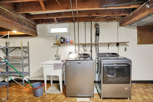 6430 E Southport Rd, Indianapolis, IN 46237 - laundry room with washer and clothes dryer and concrete block wall