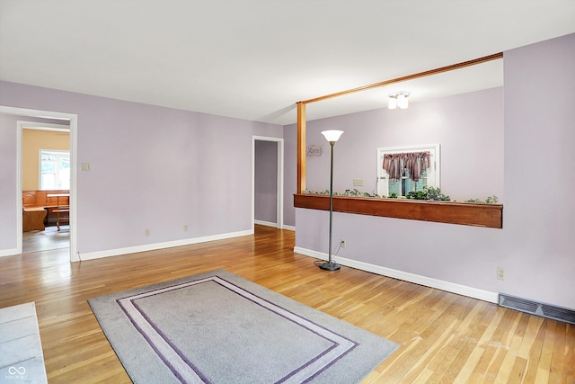 6430 E Southport Rd, Indianapolis, IN 46237 - unfurnished living room with wood finished floors