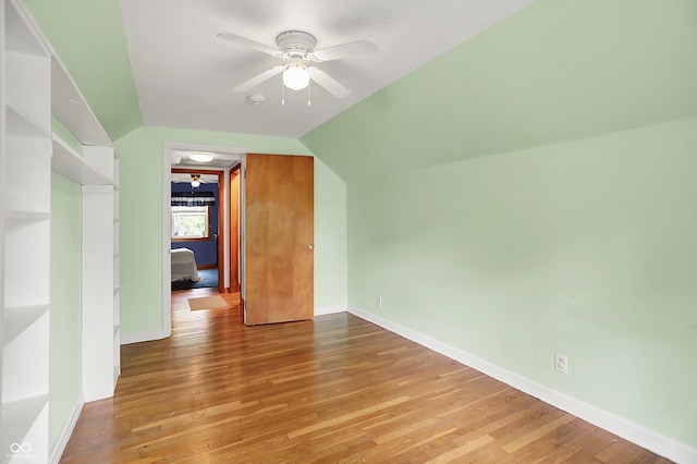 6430 E Southport Rd, Indianapolis, IN 46237 - additional living space with a ceiling fan, light wood-style floors, and vaulted ceiling
