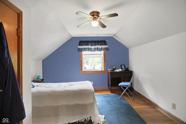 6430 E Southport Rd, Indianapolis, IN 46237 - bedroom featuring wood finished floors, a ceiling fan, and vaulted ceiling
