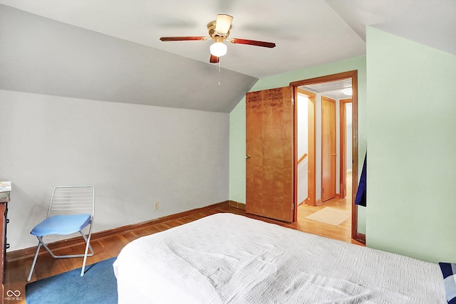 6430 E Southport Rd, Indianapolis, IN 46237 - bedroom featuring wood finished floors, vaulted ceiling, and ceiling fan