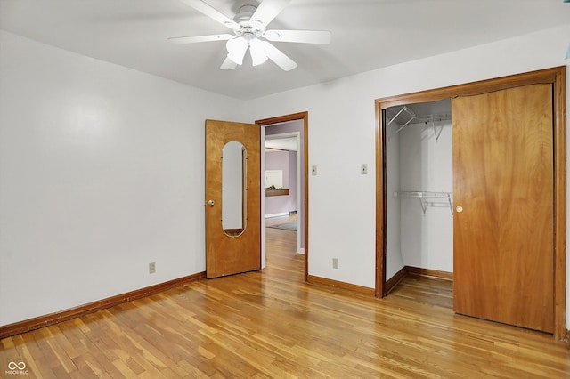 6430 E Southport Rd, Indianapolis, IN 46237 - unfurnished bedroom featuring light wood finished floors, a closet, and a ceiling fan
