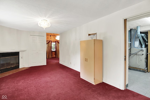 6430 E Southport Rd, Indianapolis, IN 46237 - unfurnished living room with carpet flooring, heating unit, a fireplace with flush hearth, and a chandelier
