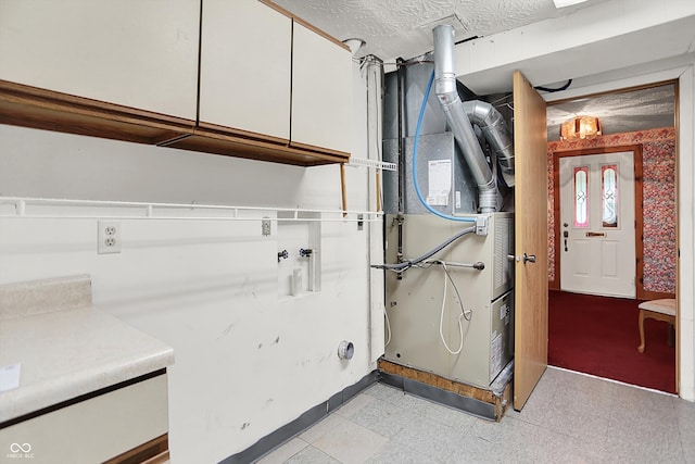 6430 E Southport Rd, Indianapolis, IN 46237 - washroom featuring cabinet space, washer hookup, and heating unit