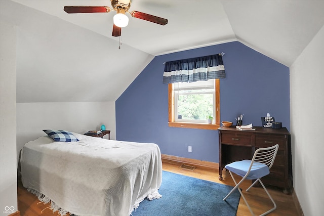 6430 E Southport Rd, Indianapolis, IN 46237 - bedroom with wood finished floors, vaulted ceiling, and ceiling fan