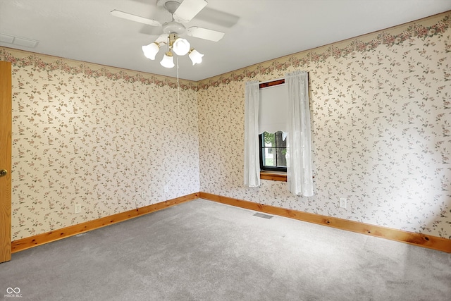 6430 E Southport Rd, Indianapolis, IN 46237 - spare room with carpet, a ceiling fan, and wallpapered walls