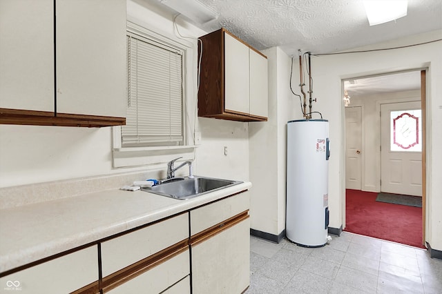 6430 E Southport Rd, Indianapolis, IN 46237 - kitchen with water heater, light countertops, white cabinetry, and light flooring
