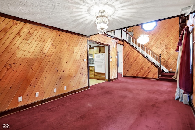6430 E Southport Rd, Indianapolis, IN 46237 - unfurnished living room with a chandelier, stairs, carpet, and wooden walls