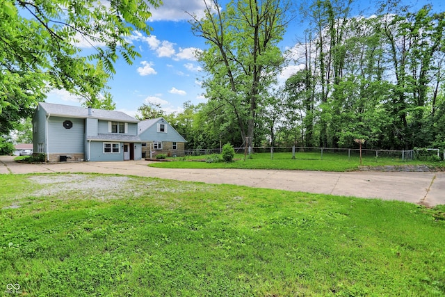 6430 E Southport Rd, Indianapolis, IN 46237 - view of yard featuring concrete driveway