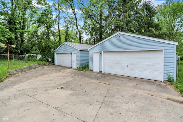 6430 E Southport Rd, Indianapolis, IN 46237 - detached garage featuring view of scattered trees