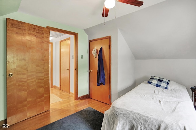 6430 E Southport Rd, Indianapolis, IN 46237 - bedroom featuring wood finished floors, ceiling fan, and lofted ceiling