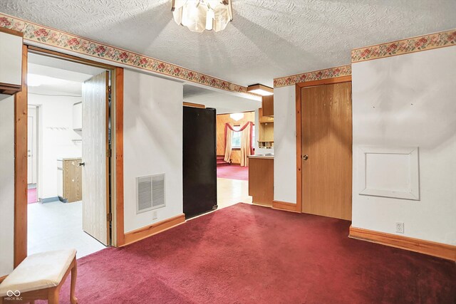 6430 E Southport Rd, Indianapolis, IN 46237 - unfurnished room featuring a textured ceiling and baseboards